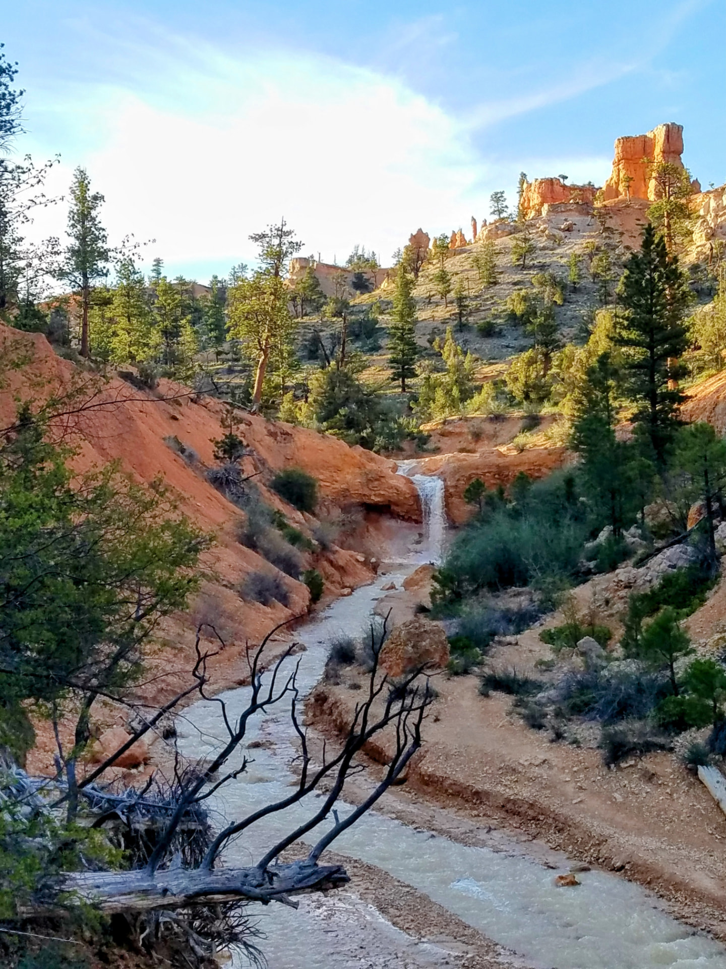 Waterfall flowing through the red rock landscape near Bryce Canyon
